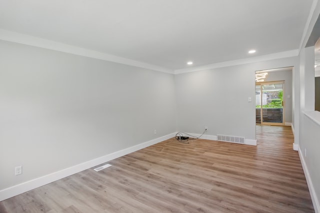 spare room featuring baseboards, recessed lighting, light wood-style floors, and ornamental molding
