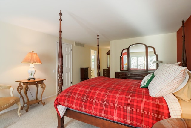 carpeted bedroom with multiple windows