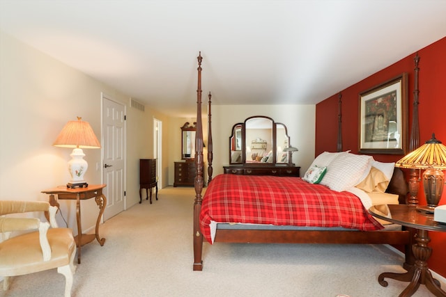 bedroom featuring light colored carpet