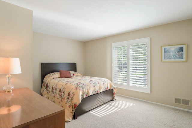 bedroom with carpet flooring and baseboards