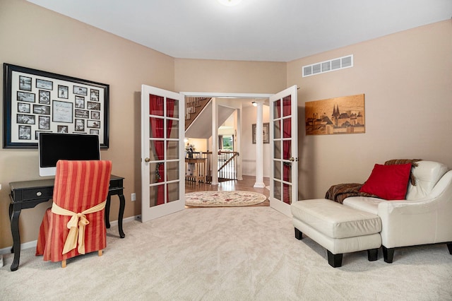 24391 Cavendish Ave E, Novi, MI 48375 - living area with french doors, carpet floors, and baseboards