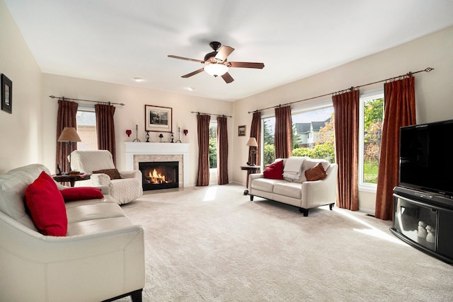 24391 Cavendish Ave E, Novi, MI 48375 - living area with ceiling fan, a fireplace with flush hearth, plenty of natural light, and carpet