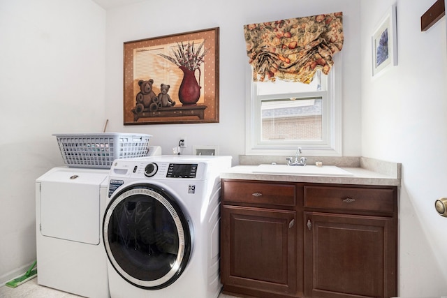 24391 Cavendish Ave E, Novi, MI 48375 - washroom featuring washer and clothes dryer and cabinet space