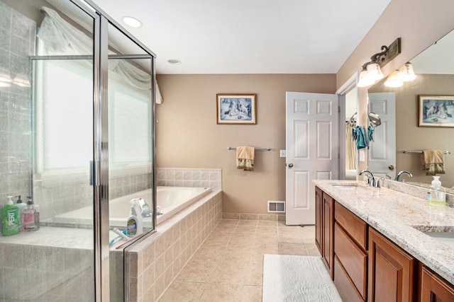 24391 Cavendish Ave E, Novi, MI 48375 - full bathroom featuring tile patterned flooring, a shower stall, a bath, and double vanity