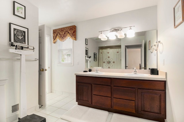 24391 Cavendish Ave E, Novi, MI 48375 - bathroom featuring tile patterned floors, a shower stall, and double vanity