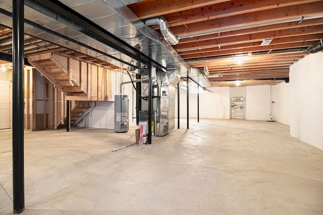 24391 Cavendish Ave E, Novi, MI 48375 - unfinished below grade area with gas water heater, heating unit, and stairs
