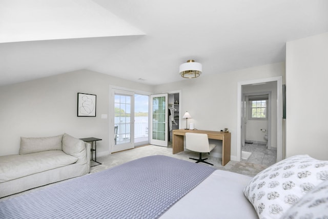 bedroom with access to exterior, baseboards, vaulted ceiling, and a water view