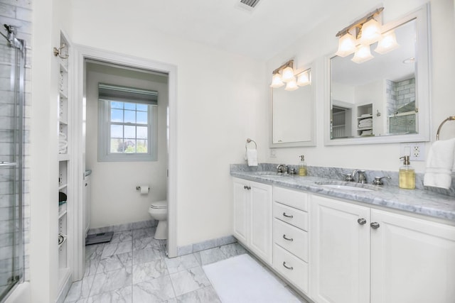 full bath with baseboards, double vanity, marble finish floors, toilet, and a shower with shower door