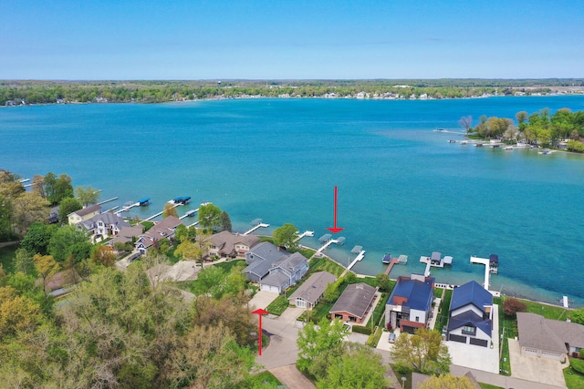 aerial view of residential area with a large body of water