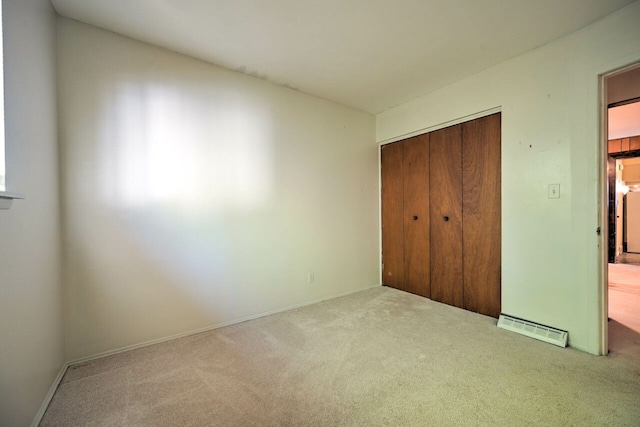 11837 Meteor Dr, Sterling Heights, MI 48313 - unfurnished bedroom with carpet flooring, a closet, and baseboards