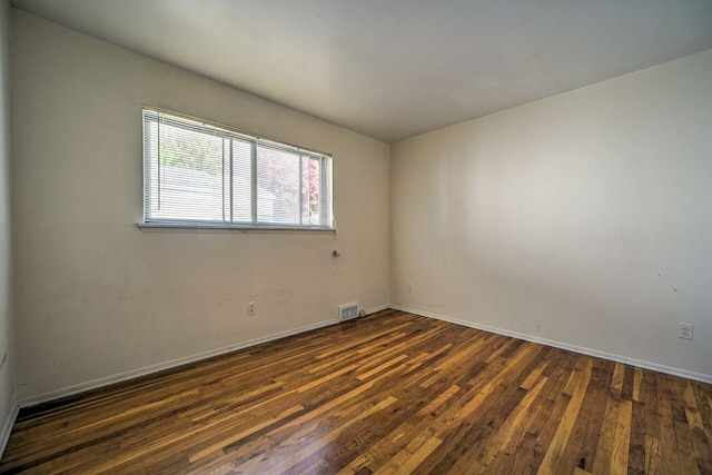 11837 Meteor Dr, Sterling Heights, MI 48313 - unfurnished room featuring dark wood-type flooring and baseboards