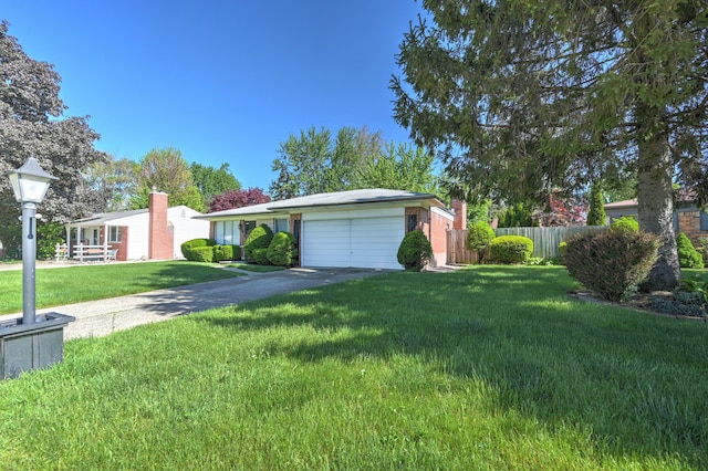 11837 Meteor Dr, Sterling Heights, MI 48313 - ranch-style home with asphalt driveway and an attached garage