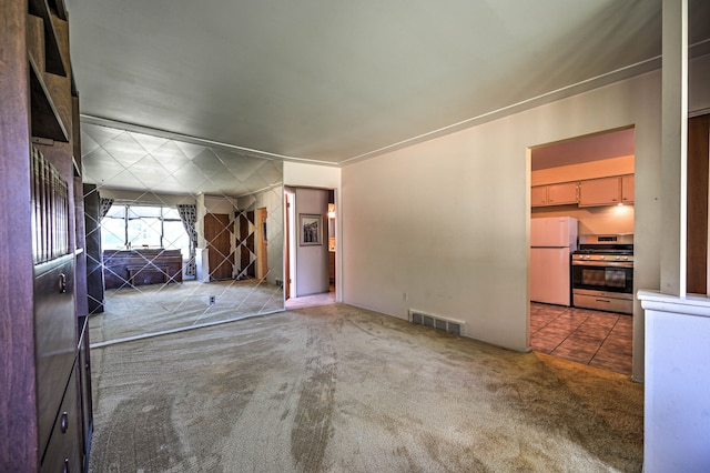 11837 Meteor Dr, Sterling Heights, MI 48313 - unfurnished living room with carpet floors and tile patterned floors