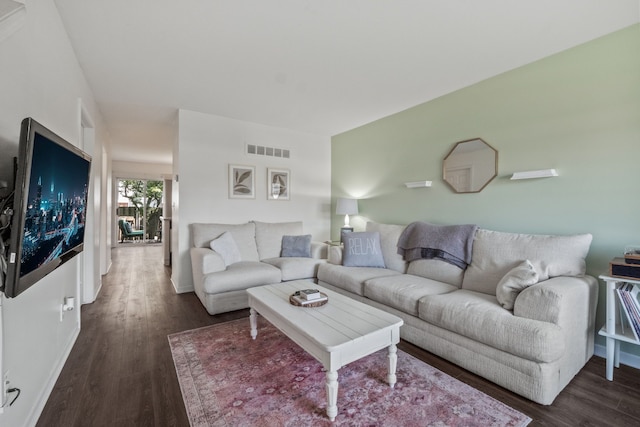 living room with wood finished floors and baseboards