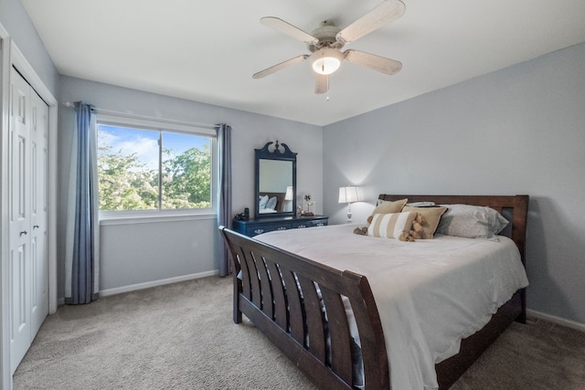 carpeted bedroom with baseboards, a ceiling fan, and a closet