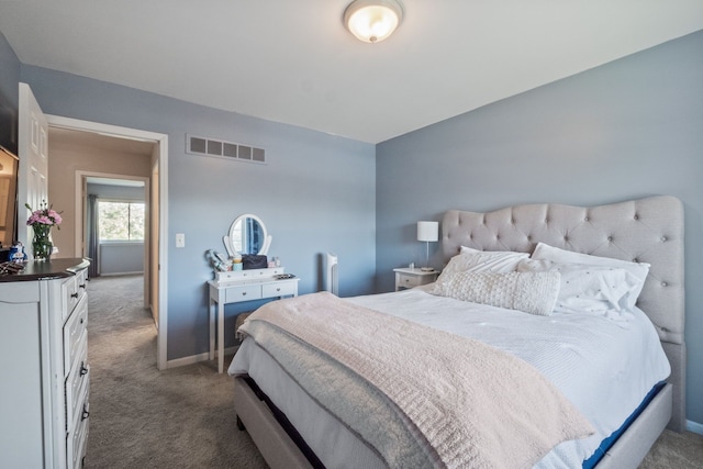 carpeted bedroom with baseboards