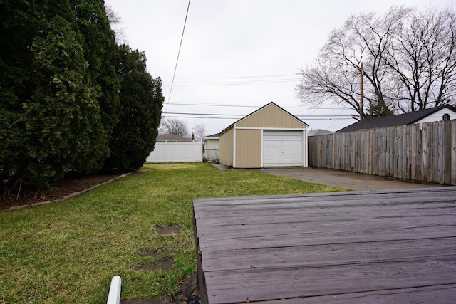 wooden deck featuring concrete driveway and an outdoor structure