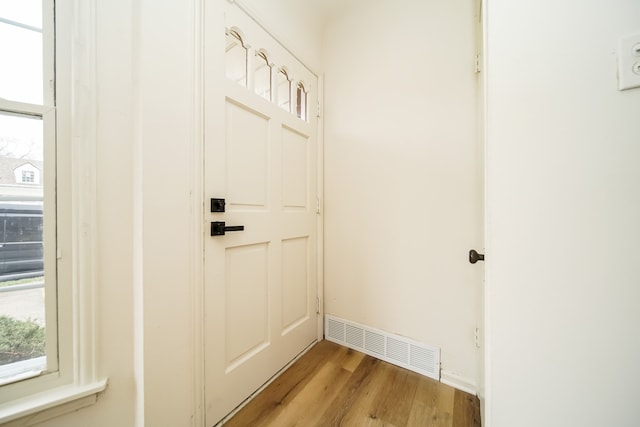 doorway to outside featuring light wood-style flooring