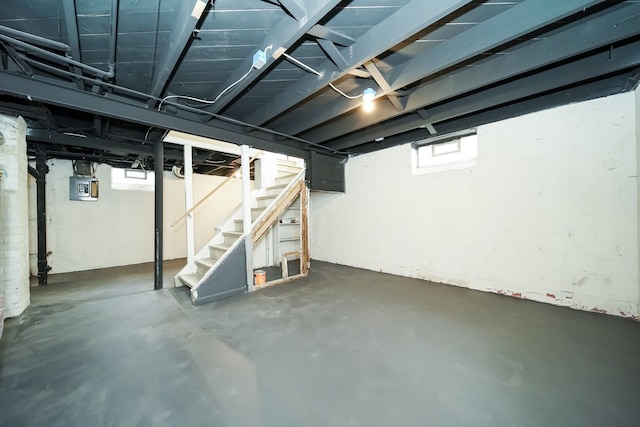 basement featuring stairs and healthy amount of natural light
