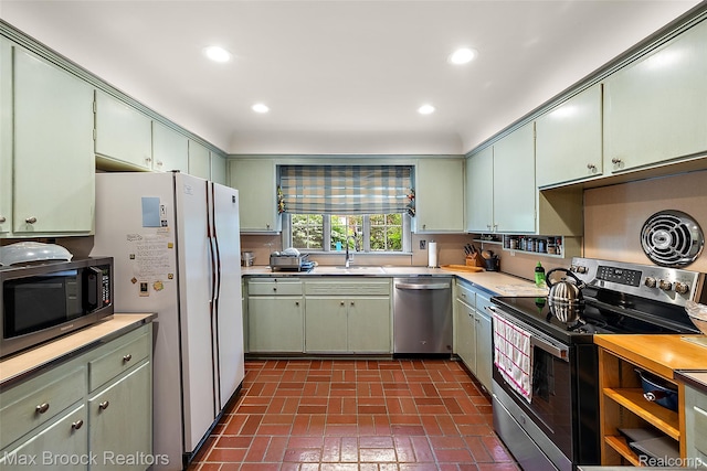 3287 Bradway Blvd, Bloomfield Hills, MI 48301 - kitchen with appliances with stainless steel finishes, green cabinets, light countertops, and recessed lighting