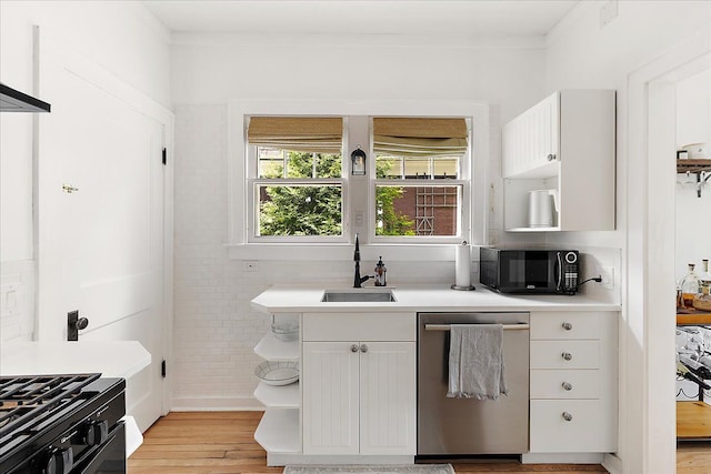 kitchen with black appliances, a sink, open shelves, light countertops, and light wood-type flooring