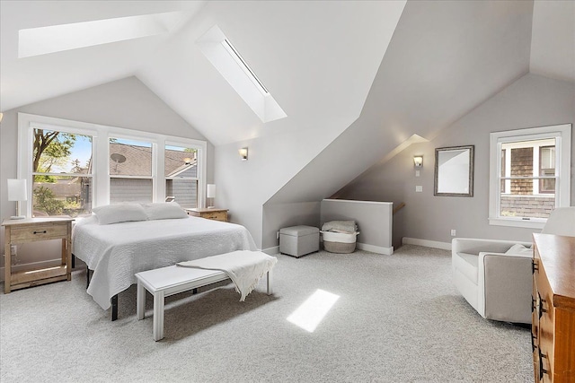 bedroom with a skylight, lofted ceiling, carpet flooring, and baseboards