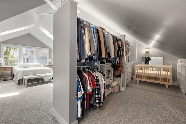 carpeted bedroom featuring vaulted ceiling