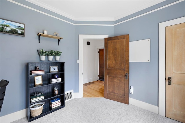 bedroom featuring crown molding, carpet floors, and baseboards