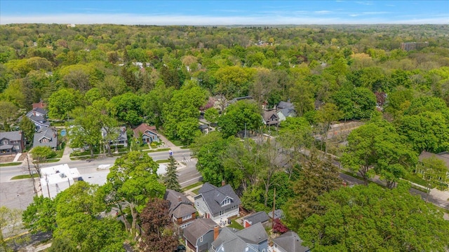 aerial view of residential area with a heavily wooded area