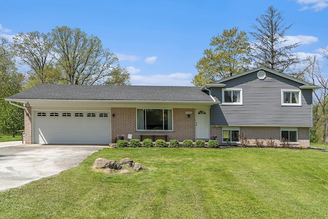 9703 Tower Rd, South Lyon, MI 48178 - split level home with driveway, a garage, a front yard, and brick siding