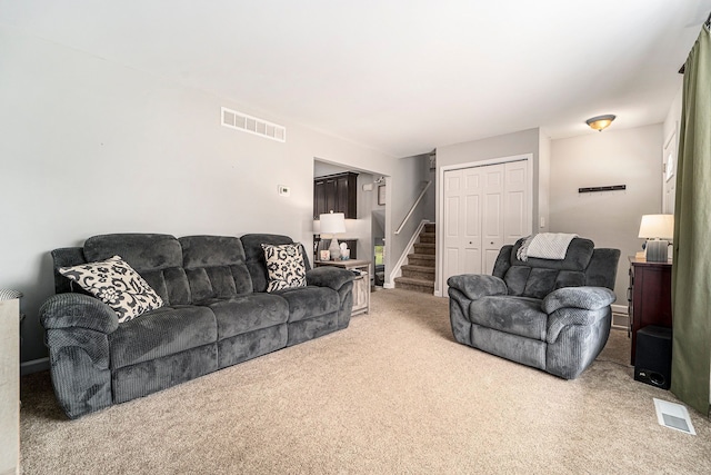 9703 Tower Rd, South Lyon, MI 48178 - carpeted living room featuring stairway