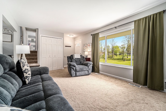9703 Tower Rd, South Lyon, MI 48178 - carpeted living room with baseboards and stairs