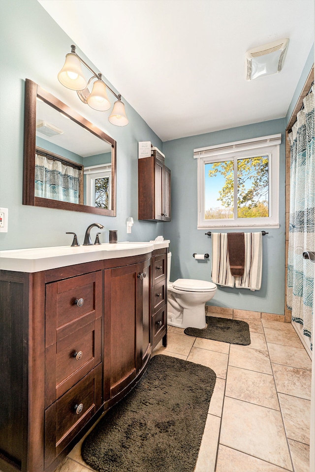 9703 Tower Rd, South Lyon, MI 48178 - bathroom with toilet, vanity, tile patterned flooring, and a shower with curtain