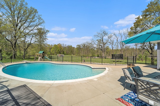 9703 Tower Rd, South Lyon, MI 48178 - view of pool featuring fence, a patio area, and a playground