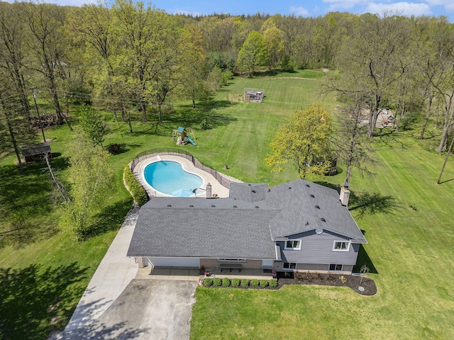 9703 Tower Rd, South Lyon, MI 48178 - view from above of property with a pool and a heavily wooded area