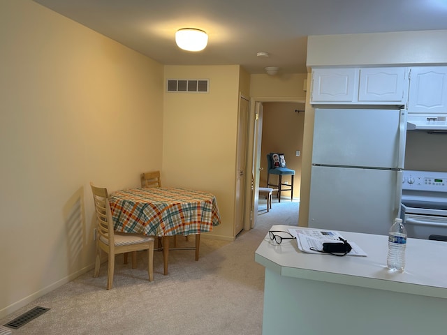 49936 Helfer Blvd Unit 8, Wixom, MI 48393 - dining room with light carpet and baseboards