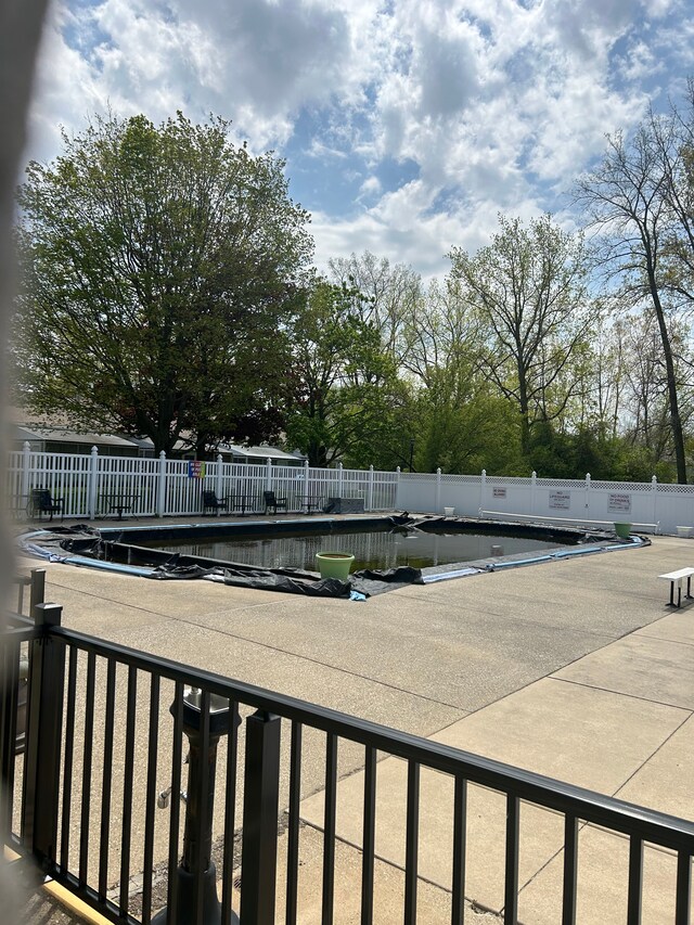 49936 Helfer Blvd Unit 8, Wixom, MI 48393 - view of pool featuring fence