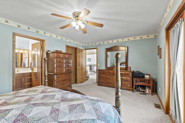 8869 E Hawley Rd, Hesperia, MI 49421 - carpeted bedroom with ensuite bath and ceiling fan