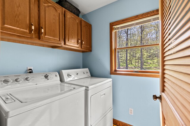 8869 E Hawley Rd, Hesperia, MI 49421 - laundry area with cabinet space and separate washer and dryer