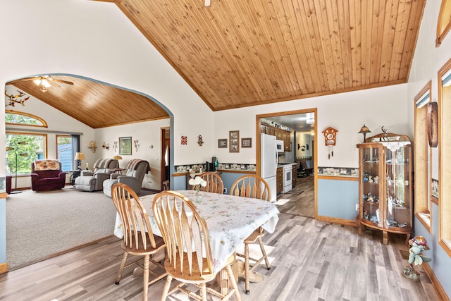 8869 E Hawley Rd, Hesperia, MI 49421 - dining room with arched walkways, wooden ceiling, high vaulted ceiling, light wood-style floors, and ceiling fan