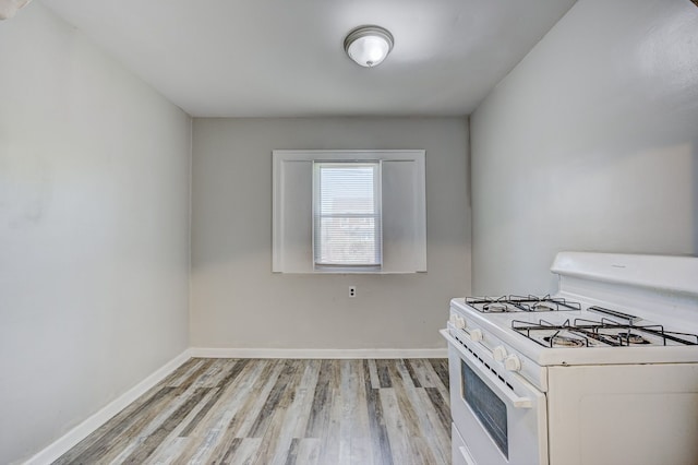18613 Santa Rosa Dr, Detroit, MI 48221 - kitchen featuring white range with gas stovetop, light wood-type flooring, and baseboards