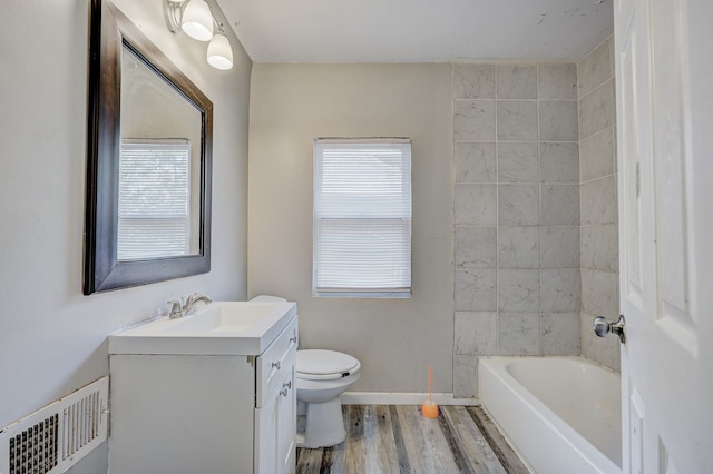 18613 Santa Rosa Dr, Detroit, MI 48221 - full bathroom with wood finished floors, vanity, toilet, and baseboards