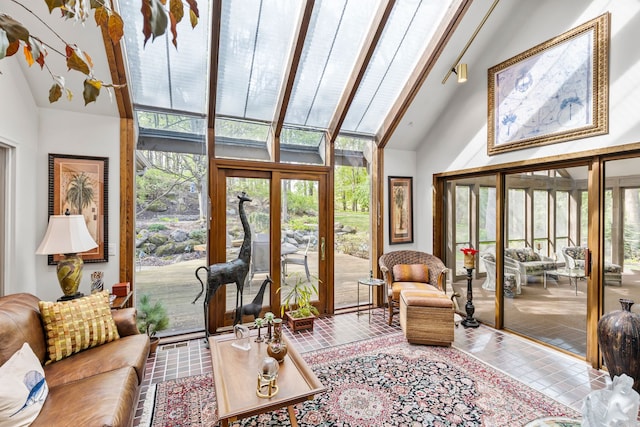 living area featuring high vaulted ceiling
