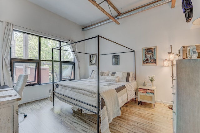 111 N Main St Unit 209, Royal Oak, MI 48067 - bedroom featuring baseboards and light wood-type flooring