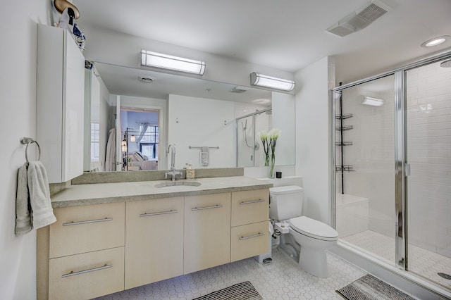 111 N Main St Unit 209, Royal Oak, MI 48067 - full bathroom featuring a stall shower, toilet, and vanity
