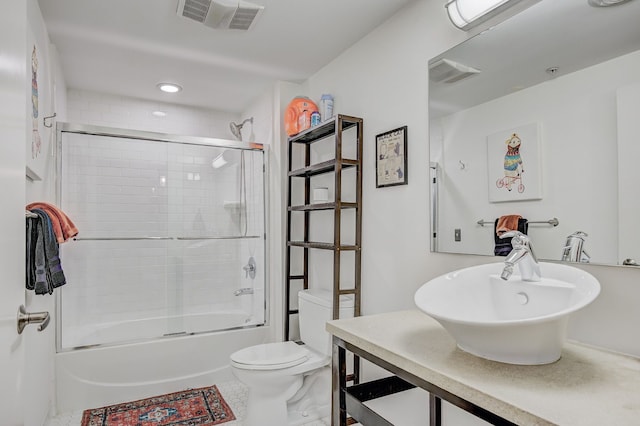 111 N Main St Unit 209, Royal Oak, MI 48067 - full bathroom with a sink, toilet, bath / shower combo with glass door, and recessed lighting
