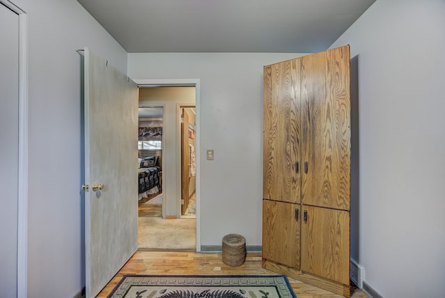 hallway featuring light wood-style floors