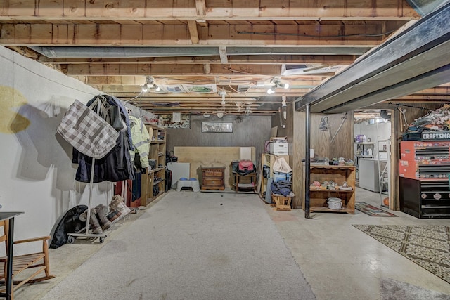 unfinished basement featuring washer / clothes dryer