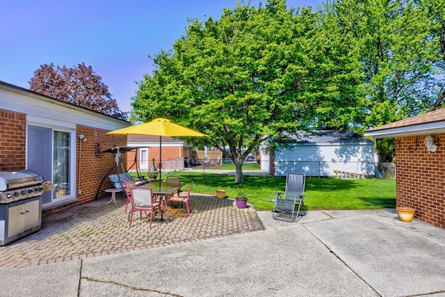 view of patio featuring grilling area and outdoor dining area