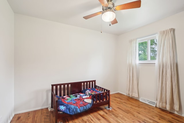 5427 Fiesta Pass, Grand Blanc, MI 48439 - bedroom with wood finished floors, baseboards, and a ceiling fan